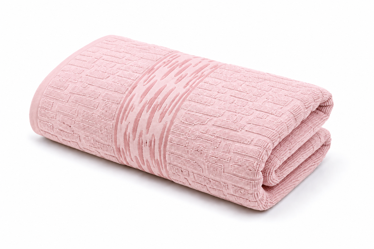 Blush pink textured bath towel with decorative woven pattern