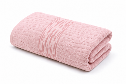Blush pink textured bath towel with decorative woven pattern