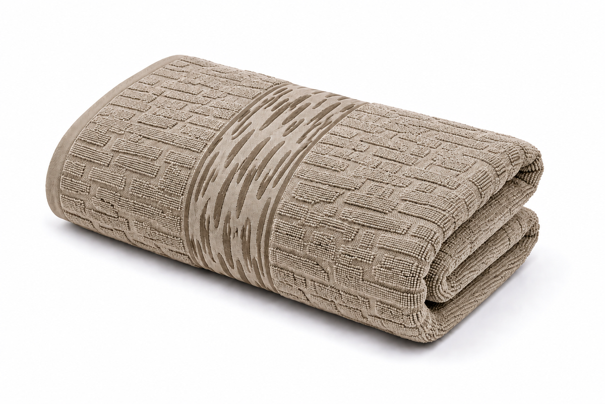 Beige textured bath towel with decorative woven pattern