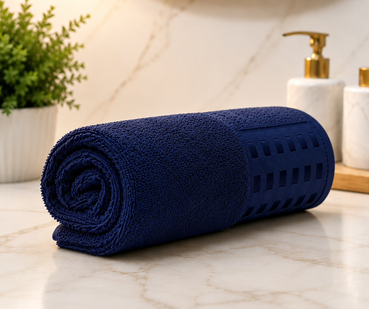 Navy blue textured bath towel with decorative woven design